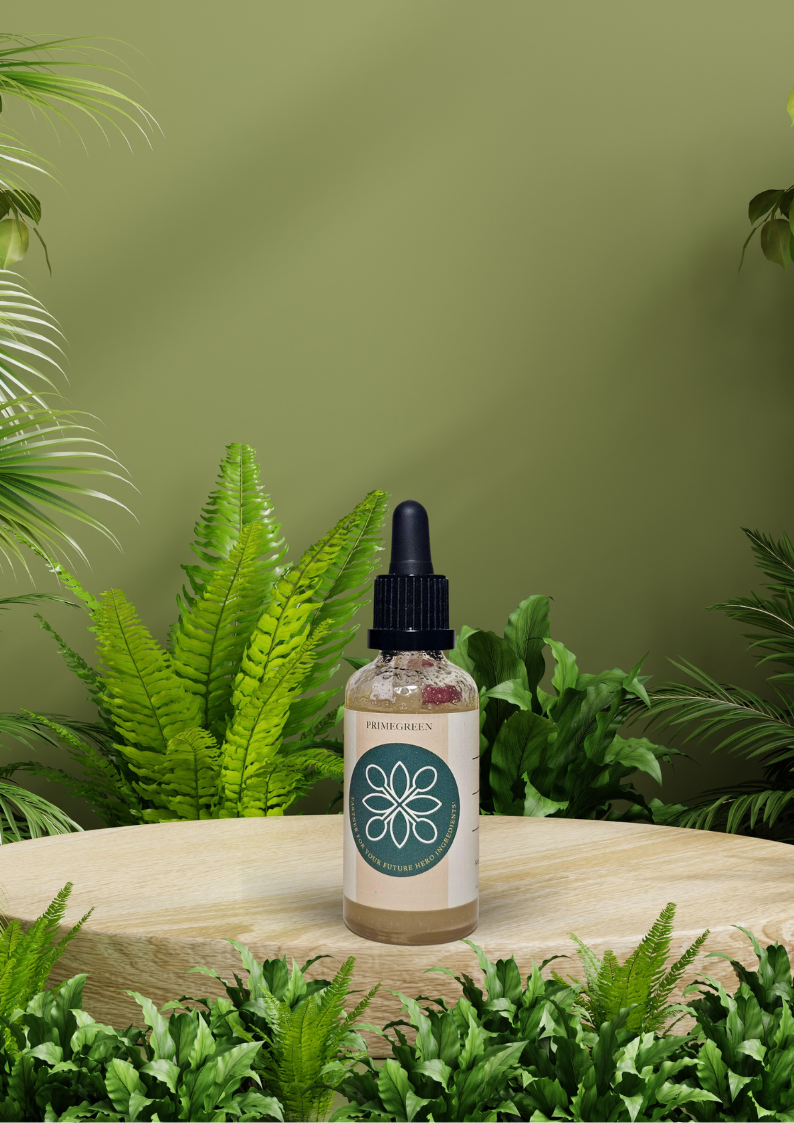 Bottle of a natural Andiroba oil with a Primegreen label on a wooden surface surrounded by green plants.