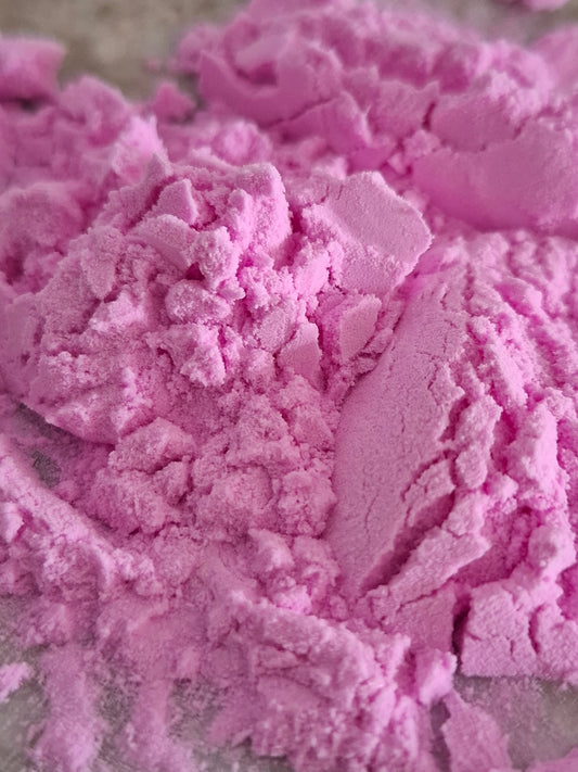 Close-up of pink powder with a blurred background